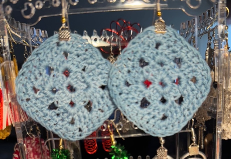 Crocheted round earrings in powder blue